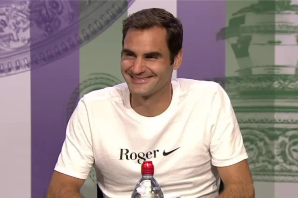 roger federer with printed banner behind