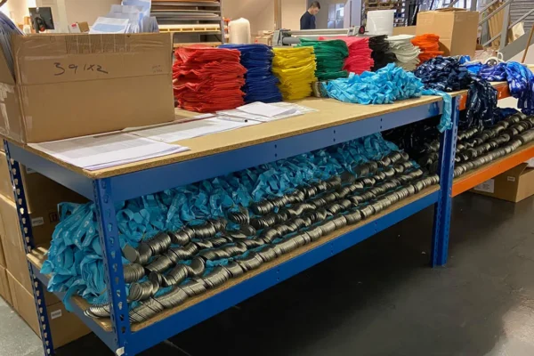 table filled with medals and t-shirts